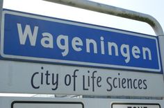 a street sign with the name wageningen city of life science written on it