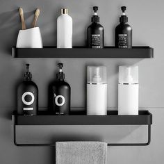 black and white bathroom shelves with soaps, lotions and hand sanitizers