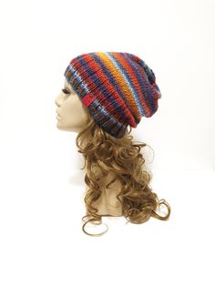 A unique, colorful, cozy, slouchy beanie, made out of high quality yarn. It's warm and comfortable to wear. The majority of wool (60%) in the yarn gives You warmth and softness, the acrylic (40%) prevents from itchiness and makes the item durable. You can wear the beanie in two ways - as a slouchy beanie, or with folded brim - this way gives more warmth to the ears.  The hat in the photo fits a standard woman's head circumference 54-56 cm, it's about 27cm-28cm high with the brim. If You wish your beanie in a different size, just let me know, I will be happy to knit it for You :-) Please take into account that the resizing may slightly affect the layout of the pattern (the skeins of wool are multicolored), but it will not change the colors of the item. Please remember, that the color of the Bohemian Knitted Beanie One Size, Bohemian Knitted Beanie, Handmade Multicolor Casual Bonnet, Casual Handmade Multicolor Bonnet, Bohemian Knitted Beanie Cap, Cozy Multicolor Hat, One Size Fits Most, Cozy Multicolor Hand Knitted Hat, Handmade Multicolor Fall Hats, Bohemian Hand Knitted Winter Beanie