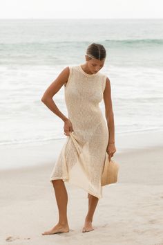 The Dolce Vita Cotton Knit Dress features an open knit design. Wear it over a swimsuit at the beach or pool as a cover-up. Made with soft cotton material for a breathable and lightweight feel. Summer Beige Knit Cover-up, Chic Open Knit Dress For Beach Cover-up, Beachy Sleeveless Crochet Dress For Poolside, Sleeveless Crochet Dress For Poolside And Beach, Beige Stretch Dress For Beach Season, Sleeveless Crochet Dress For Poolside, Stretch Beige Dress For Beach Season, Beige Crochet Dress For Beach Cover-up, Beachy Crochet Dress For Beach Season Day Out