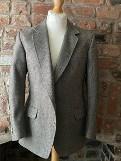 "Vintage green and brown tweed jacket in pure new wool by Crombie for Centaur.  Details: notch lapels, button hole, handkerchief pocket, side pockets with flaps, three interior pockets, lined in tonal viscose, two button fastening with matching trio of buttons on cuffs, single rear vent.  Size 40 Measurements Flat  Pit to Pit  Shoulder to Shoulder 20\" 51cm Sleeve 24\" 60cm Length 29 1/2\" 75cm Outstanding Vintage Condition" Tweed Notch Lapel Outerwear With Button Closure, Fitted Tweed Blazer With Lapel Collar, Tweed Notch Lapel Jacket With Button Closure, Semi-formal Single Button Wool Tweed Jacket, Winter Tweed Business Blazer, Formal Single Breasted Tweed Blazer, Single Button Long Sleeve Tweed Jacket For Business, Winter Business Tweed Blazer, Fitted Tweed Jacket For Business In Winter