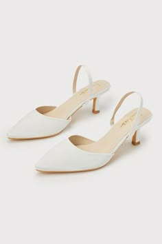 Your favorite going-out heels just dropped, and the Lulus Leith White Satin Kitten Heel Slingback Pumps are ready to get the party started whenever you are! Keep things ultra-chic with these sleek satin pumps that feature a single sole silhouette, a classy pointed-toe upper with a low-cut collar, and a slender slingback strap (with a bit of elastic at the side for fit). A trendy kitten heel completes the iconic design. 2. 5" wrapped kitten heel. Cushioned insole. Felted rubber sole has nonskid m White Heels Sandals, Shoes White Heels, Kitten Heels Wedding, Princess Heels, Kitten Heel Wedding Shoes, White Bridal Shoes, Bridal Shoes Low Heel, Ivory Shoes, Cute Shoes Heels