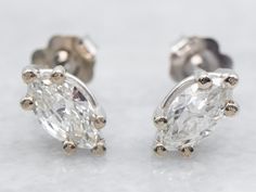 These marquise-cut diamond stud earrings have classic post-back findings that keep them secure and comfortable when worn. The diamonds themselves are full of fire and sparkle with excellent clarity. Crafted of 14-karat white gold, these earrings are a wardrobe staple! Metal: 14K White GoldGem: 2 Diamonds totaling .88 Carats, VS in Clarity, I in ColorGem Measurements: 4.0 x 7.5 mm, Marquise Cut Anniversary Diamond White Marquise Cut Earrings, White Gold Diamond Earrings, Earrings White Gold, Marquise Cut Diamond, April Birthstone, Gold Diamond Earrings, Gold Stud Earrings, Earrings White, Diamond Stud Earrings