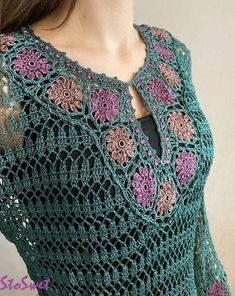 a woman wearing a green crochet top with pink flowers