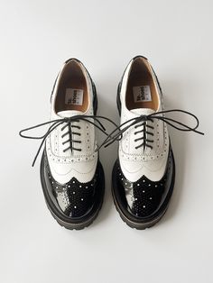 Black and white oxford shoe woman. Comfortable pad.  The rounded sock is complemented by decorative welt. Closed lacing and lots of perforations.  On the sock is a medallion. A beautiful addition to oxfords. Rubber sole Vibram (Italy) with tread that adds massive vapors. To see more shoe woman from our collection click: https://www.etsy.com/shop/TeShoes PRODUCT INFORMATION Colour: black & white Upper: toe - patent leather, genuine smooth leather Lining: leather Sole: EVA, polyurethane (Vibram) * White Oxford Shoes, Oxford Shoes Women, Silver Oxfords, White Oxford, Shoes Chunky, Oxford Shoe, Oxford Platform, Saddle Shoes, Oxford White