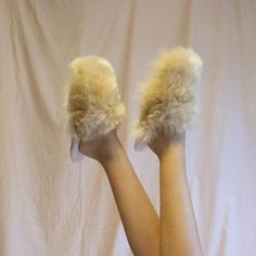 Pamper your feet and keep them snug, even on the coldest days, with these irresistibly soft slippers alpaca.Soft alpaca slippers are handmade by Peruvian artisans who deal with freezing temperatures in the Andean Highlands on a daily basis.The outer lining of these alpaca slippers is made from high quality alpaca wool; super soft. The inside is made of Merino wool: breathable, temperature-regulating, and odour-resistant.- Made of 100% Alpaca Suri.- Spot clean.- Alpaca wool outer lining.- Merino Cozy Faux Fur Slippers With Round Toe, Cozy Fluffy Slip-on Slippers, Fluffy Slip-on Cozy Slippers, Comfortable Fluffy Sheepskin Slippers, Fluffy Sheepskin Comfortable Slippers, Fluffy Comfortable Sheepskin Slippers, Soft Faux Fur Slippers With Round Toe, Fluffy Slip-on Indoor Slippers, Fluffy Slip-on Slippers For Indoor Use