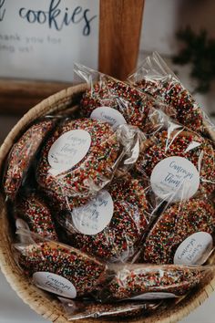 a basket filled with lots of colorful sprinkles on top of a table