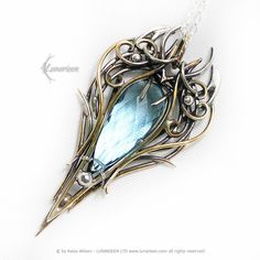 TINNARIEELH - Exclusive, Gothic, fantasy-style pendant, mix-metal necklace. Fully handmade work (oxidized and polished silver, brass). Main base gem: Blue Quartz 13Ct (2.6g).  Material: Mix Metal, Sterling Silver, Fine Silver / 925, 999, and Brass (patinated, polished and covered with protective varnish). Sterling Silver chain (optional), length: 44cm + 7 cm, (Rolo) with a decorative clasp, adjustable. Pendant length: 6,4 cm, width 3,2 cm. Color: Silver, Gold, Blue. * * * * * * * * * * * * * * * Gothic Metal Jewelry For Fantasy Events, Fantasy Metal Pendant Necklace, Bronze Metal Fantasy Necklace, Gold Metal Jewelry For Fantasy Events, Fantasy Style Bronze Metal Necklace, Elven Style Metal Jewelry Gift, Fantasy Pendant Jewelry For Fantasy Events, Elven Style Metal Jewelry For Gifts, Fantasy Pendant Necklace For Fantasy Events