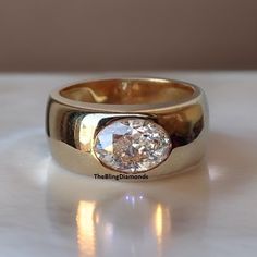 a diamond ring sitting on top of a table