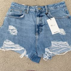 Light-Medium Wash Denim Shorts With Rips Forever 21 High Rise Bottoms For Summer, Forever 21 High-rise Summer Bottoms, High-waisted Jean Shorts From Forever 21 For Spring, High Rise Bottoms From Forever 21 For Summer, Forever 21 Summer Cutoff Shorts, Forever 21 Cutoff Jean Shorts For Summer, Forever 21 High Waist Ripped Bottoms, Forever 21 Ripped Summer Bottoms, Forever 21 Light Wash High Rise Shorts