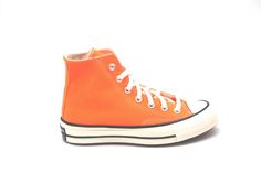 As part of their seasonal color drop, Converse offers this popping orange rendition of their Converse Chuck 70 Hi. Dipped in an eye-catching color, the high-top retro sneaker with vintage vibes offers a summery feel packed with history.   - Converse Chuck 70 Hi TotalOrng - Polyester-canvas upper - OrthoLite insole for improved cushioning - Winged tongue stitching - Rubber outsole Converse outfits the legendary Chuck Taylor All Star 70 with a series of modern upgrades, while maintaining the sneak Orange Converse, Converse Outfits, New Converse, Converse Chuck 70, Outfits With Converse, Chuck 70, Retro Sneakers, Core Values, Season Colors