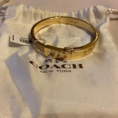 Gold And Crystal Coach Hinge Bangle. Has Magnetic Clasp And Latch Above. Comes With Bag Bengal Bracelets, Big Bangles, Coach Bracelets, Gold Bangle, Classy Purses, Perfume Jewelry, Coach Jewelry, Dope Jewelry Accessories, Coach Accessories