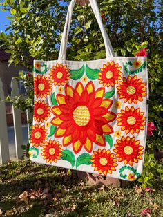 This stunning embroidered flower tote bag is an absolute must-have. Incredible detailing with breathtaking colors that will have everyone complimenting. Beautifully made by Artisans in Mexico.  Large enough to use for shopping, use as a diaper bag, school, beach, and everyday use.  Please advise that each bag is handmade and each design will vary. Some of the designs might have different flower shapes and colors may be slightly different from the image due to picture editing. If you want a speci Multicolor Bags With Embroidered Logo For Everyday Use, White Tote Shoulder Bag With Embroidered Logo, Multicolor Floral Embroidered Tote Bag, White Cotton Bag With Floral Embroidery, White Cotton Bags With Floral Embroidery, White Cotton Shoulder Bag With Floral Embroidery, Multicolor Embroidered Tote Bag, White Rectangular Bags With Machine Embroidery, White Rectangular Bag With Machine Embroidery