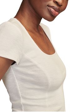 Rib stitching adds just the right amount of stretch to a fitted T-shirt in a perfectly cropped length. Square neck Short sleeves 58% cotton, 37% polyester, 5% spandex Machine wash, tumble dry Imported Sporty Scoop Neck Fitted Top, Sporty Fitted Scoop Neck Top, Sporty Fitted Ribbed T-shirt, Sporty Fitted Top With Scoop Neck, Ribbed Cotton Crop Top T-shirt, Fitted Ribbed Cropped Cotton T-shirt, Sporty Fitted Top With Ribbed Neckline, Fitted Cropped Tops With Ribbed Neckline, White Scoop Neck Top With Ribbed Neckline