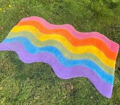 a blanket that is laying on the grass