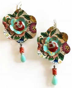 the earrings are decorated with flowers and beads