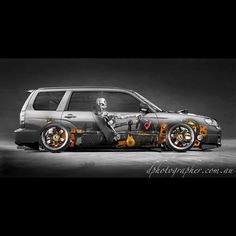 a black and white photo of a car with skulls on the front wheel rims