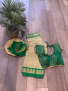 Beautiful silk mark certified Mysore silk saree in pastel pista green shade with contrast dark green mango border and pallu. The saree is pure silk and comes with chit pallu.  Falls and pico are done. Saree comes with blouse piece. Blouse shown in picture is for decoration only. Pista Green Art Silk Pre-draped Saree For Puja, Green Chanderi Pre-draped Saree For Puja, Green Chanderi Pre-draped Saree For Festivals, Green Pre-draped Saree With Self Design For Diwali, Green Anarkali Chanderi Blouse Piece, Elegant Green Banarasi Silk Blouse Piece, Green Semi-stitched Blouse Piece With Zari Weaving, Green Semi-stitched Tussar Silk Blouse Piece, Green Art Silk Blouse Piece With Cutdana