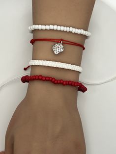 Strawberry Strawberries Charm Friendship Bracelet. Pura Vida style string, braided, woven, beaded, adjustable bracelet.  Fits most wrists and are stackable.  Perfect for everyday casual wear, activities, and special events. Can be worn individually or as a set. SIZING: White Braided Bracelet:  6 - 11 inches Beaded Red/White Bracelet:  2.36 inches CARE: Bracelets are durable, but excess pulling or yanking may cause them to break. SPECIAL NOTES: Your new bracelet may be slightly sticky/tacky for a few days.  This will not last, but may make adjusting slightly difficult for a bit. Casual Braided Beaded Bracelets As Gift, Casual Braided Beaded Bracelets For Gift, Casual Braided Beaded Bracelets For Beach, White Braided Beaded Bracelets As Gift, White Braided Casual Jewelry, Casual White Braided Jewelry, Casual Beaded Bracelet With Macrame And Round Beads, Casual Beaded Bracelet With Macrame, Casual Macrame Beaded Bracelet With Round Beads