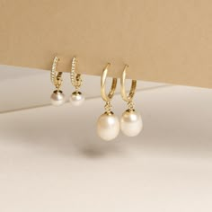 We’re picky about our pearls. Our collection of modern-feel pearl pieces takes your grandmother's favorites and incorporates them into the latest trends, interpreted from our NYC-gal perspective. These gem-quality pearls are freshwater cultured beauties, set in solid gold that won't tarnish or flake. We may have expensive taste, but crazy mark-ups aren’t really our thing. So we balance the best quality and the best price — enough said. 10k Solid yellow gold 0.14ct Pave white diamond (approx) Han Classic Teardrop Pearl Earrings For Everyday, Classic Teardrop Pearl Earrings For Everyday Elegance, Everyday Classic Teardrop Pearl Earrings, Classic Yellow Gold Pearl Earrings For Everyday Elegance, Classic Yellow Gold Pearl Earrings For Everyday, Everyday Pearl Drop Earrings, Elegant Everyday Pearl Earrings With Charm, Classic Briolette Pearl Earrings, Timeless Yellow Gold Pearl Earrings For Everyday Elegance