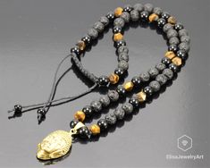 "Buddha Necklace Natural Tiger Eye Black Lava Onyx Beaded Protection Best Friend Gift Boyfriend Gift Handmade Necklace Boho Necklace Gift -ALL THE PRODUCTS AT ELISAJEWELRYART ARE HANDMADE AND MADE WITH NATURAL BEADS. -WHAT DOES THE ONYX STAND FOR A powerful protection stone, Black Onyx absorbs and transforms negative energy, and helps to prevent the drain of personal energy. Black Onyx aids the development of emotional and physical strength and stamina, especially when support is needed during t Spiritual Black Beaded Crystal Necklace, Black Spiritual Crystal Necklaces, Onyx Black Beads Necklace As A Gift, Onyx Beaded Necklace With Black Beads As A Gift, Black Beaded Necklaces With Natural Stones For Gifts, Black Spiritual Crystal Necklace, Handmade Spiritual Black Beads, Handmade Black Spiritual Beads, Black Natural Stones Beads For Gifts