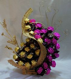 a basket filled with chocolates and flowers