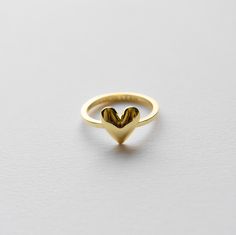 Let's celebrate love with our 'Flora' heart ring in sterling silver. This ring has a shiny polished finish. It's perfect for a festive occasion or everyday wear. Materials * Gold vermeil: recycled sterling silver base with a thick layer of recycled 18k gold (5 times as thick as gold plated) Dimensions * Heart: 10mm x 10xmm Classic Gold Heart Ring, Tarnish Resistant, Classic 14k Gold Heart-shaped Signet Ring, Gold Heart-shaped Enamel Ring For Anniversary, Yellow Gold Heart Ring With Charm, Fine Jewelry, Gold Heart-shaped Enamel Rings, Jewelry Manufacturers, Let's Celebrate, Recycled Metal, Recycled Sterling Silver