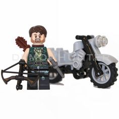 there is a lego man riding a motorcycle with an arrow on the front and side