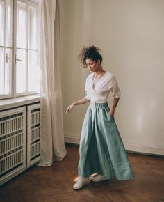 ♠ Nothing more feminine than this rich bohemian style skirt that is made of 100% pure linen. This flared midi skirt has a high rise, a waistband and side pockets. Pictured in a dusty turquoise shade here, this bohemian linen piece is available to order in multiple colors. ♠ Sizes The model on the picture is 165 cm/5'5" tall and is wearing size S. Have a look at my Size Chart below to make sure your piece will fit you best. ** Custom Orders For any changes or adjustments you may need, please cont Bohemian Long Relaxed Skirt, High Waist Bohemian Pleated Skirt, Bohemian High Waist Pleated Skirt, Bohemian Long Wrap Skirt With Lining, Bohemian High Waist Maxi Skirt With Elastic, Bohemian Voluminous Lined Maxi Skirt, Bohemian Bottoms With Elastic Waistband And Voluminous Skirt, Bohemian High Waist Maxi Skirt With Elastic Waistband, Bohemian Voluminous Maxi Skirt