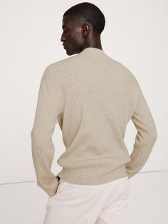 Using our warmest Merino wool, this luxe mock-neck sweater is crafted with a textured rib stitch in a relaxed fit.  Relaxed fit.  Responsible Wool Standard Certified: This global standard protects the sheep that supply the wool for this garment as well as the land they graze, working to make it better for the environment and the sheep.  Mock-neck.  Straight hem.  Relaxed fit.  Long sleeves.  Hip length.  Model: Size M, 6'2" (188cm). Beige Turtleneck Sweater With Ribbed Neckline, Classic Ribbed Wool Sweater, Beige Sweater With Ribbed Neckline For Work, Workwear Funnel Neck Sweater With Ribbed Neckline, Beige Ribbed Neckline Sweater For Work, Wool Ribbed Outerwear For Work, Ribbed Wool Outerwear For Work, Wool High Neck Sweater With Ribbed Cuffs, Funnel Neck Sweater With Ribbed Cuffs For Work