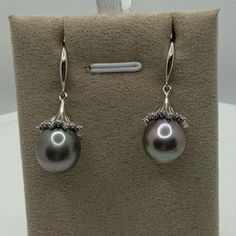 100% Natural And Genuine Tahitian Pearl Earrings! Luster Aaa! Contemporary Dangling Style! Pearl Size Approx. 11.4mmx12.6mm. Grey Tahitian Pearls With Beautiful And Rare Lilac Overtone. Please Note, Every Pearl Is Unique In Color, And There Can Be Light And Not Very Noticeable Difference Between Pearl, Which Is Normal And Acceptable! Also, Natural Pearls Can Have Minor Birthmarks, If That’s Not Acceptabledon’t Buy! Pearls Came From Polynesia! Dangle Style, 18k White Gold Plated Over Sterling Sil Classic Silver Platinum Pearl Earrings, Tahitian Pearl Jewelry With Matching Earrings For Anniversary, Elegant Tahitian Pearl Jewelry For Anniversary, Fine Jewelry Silver Akoya Pearl Earrings, Classic Tahitian Pearl Earrings In White Gold, Classic White Gold Tahitian Pearl Earrings, Formal White Gold Jewelry With Tahitian Pearl, Luxury Silver Sterling Silver Pearl Earrings, Elegant Silver Platinum Pearl Earrings