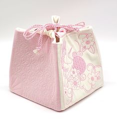 This beautiful soft pink and white bag was sewn in the Japanese style of the Komebukuro technique and quilted with elegant sashiko embroidery. In the past Komebukuro bags were used in Japan to store rice, so it sits on the ground nicely and has a pretty shape when filled. You can use it as a storage bag for knitting utensils, cosmetics, grain and all sorts of other things, or as a bag to transport your wallet or lunch box. The perfect accesoire for festivities like the wedding! Please indicate t Pink And White Bag, Embroidered White Rectangular Pouch, Japanese Drawstring Bag Pattern, Embroidered Pink Pouch As Gift, Embroidered Pink Pouch For Gift, Embroidered Pink Pouch For Gifts, White Embroidered Rectangular Pouch, Pink Square Pouch For Gift, Pink Embroidered Pouch For Gift