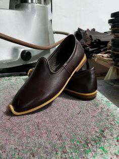 These are genuine leather, handmade men's shoes. Very useful soft shoes. Made with naturel leather and naturel dyed. There are many diffirent color options.  Every size is available, 5 us men's to 13.5 us men's, 37 eu men's to 50 eu men's. #loafermen #leathermenflats #medievalsandals #oxfordshoes #mengift Traditional Leather Loafers, Traditional Plain Toe Leather Shoes, Artisan Brown Slip-on Moccasins, Traditional Leather Sole Slip-on Loafers, Traditional Leather Moccasins With Rubber Sole, Traditional Brown Leather Shoes With Leather Footbed, Traditional Brown Leather Shoes With Rubber Sole, Artisan Leather Slip-on Shoes With Rubber Sole, Traditional Brown Round Toe Slip-ons