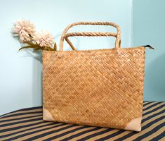 Introducing our Chic Handwoven Thatching Tote Bag, a perfect blend of traditional craftsmanship and modern design.  Each bag is carefully handcrafted from high-quality thatching, offering a unique texture and durable construction that stands the test of time. 🔷️ This tote bag is ideal for those who appreciate the artistry of handwoven accessories.  🔷️ It features a robust design with sturdy handles, making it both stylish and practical for everyday.    🔷️ The neutral tone and classic shape al Summer Tote Bag, Summer Tote Bags, Summer Tote, Casual Day Outfits, Robust Design, Neutral Tones, Timeless Pieces, Hand Weaving, Modern Design