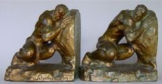 pair of bronze bookends depicting two men wrestling