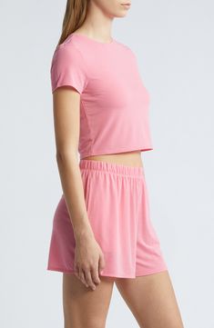 Cut from a lightweight, lightweight fabric with a softly ribbed texture, this cropped T-shirt takes your lounge game to the next level of comfort. 16 1/2" length (size Medium) Crewneck Short sleeves 59% polyester, 32% viscose, 9% spandex Machine wash, tumble dry Imported Athleisure Crop Top T-shirt For Loungewear, Trendy Fitted Cropped T-shirt For Loungewear, Trendy Cropped T-shirt For Spring Loungewear, Casual Cropped Seamless T-shirt, Short Sleeve Tops For Spring Lounging, Seamless Solid Color Crop Top For Loungewear, Summer Athleisure Crop Top With Crew Neck, Basic Stretch Cropped T-shirt For Loungewear, Casual Ribbed Cropped Cotton T-shirt