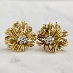 Unique and detailed Chrysanthemum flower earrings in 18K yellow gold. Featuring 3/4 of a carat in clean Old European Cut diamonds. Omega backs work securely with no issues to note. Fully tested, polished and ready to wear. We are a brick and mortar store located in Alhambra, CA. All items are guaranteed as described. SPECIFICATIONS: Diamond: .75ctw / VS - SI H - I Color / Old European Cut Measurement: 1 in diameter each Total Weight: 17.7 grams These earrings have been inspected by professionals Yellow Gold Flower Cluster Earrings For Anniversary, Formal Yellow Gold Cluster Earrings In Flower Shape, Formal Yellow Gold Flower Earrings With Prong Setting, Gold Diamond Flower Earrings For Formal Occasions, Formal Gold Diamond Flower Earrings, Formal Gold Flower Cluster Earrings, Yellow Gold Flower-shaped Clip-on Earrings For Formal Events, Formal Yellow Gold Flower Earrings, Classic Yellow Gold Flower Earrings For Formal Occasions