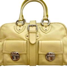 Marc Jacobs Venetia Bag Buttery Soft Calf Leather In Tapioca Yellow Alcantara Suede Lining Silver Tone Hardware Zip Top Buckle Closure Front Flap Compartments Inside Zip, Slip And Flap Pockets Measures Approximately 15" X 9" X 4" Includes Original Marc Jacobs Dust Bag Style No. C343001 100% Calf Leather Made In Italy Note: Very Tiny Scuff On Bottom And Some Hidden Marks Behind Silver Handle Rings Otherwise In Excellent Unused Condition. Please See Photos! Classic Yellow Shoulder Bag With Handles, Designer Yellow Bag With Top Carry Handle, Classic Yellow Shoulder Bag, Luxury Yellow Bag With Top Carry Handle, Designer Yellow Satchel With Detachable Strap, Classic Yellow Shoulder Bag With Top Carry Handle, Luxury Yellow Satchel With Gold-tone Hardware, Classic Yellow Satchel With Detachable Handle, Classic Yellow Satchel With Top Carry Handle