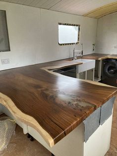 a kitchen counter made out of wood in a mobile home