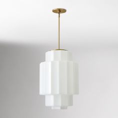 a white light fixture hanging from a ceiling