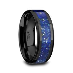 a black ceramic ring with blue and yellow stars inlay