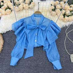 Chiffon Blouse With Ruffles For Office, Trendy Party Blouse With Ruffle Hem, Office Shirt With Ruffled Collar And Details, Solid Color Shirt For Spring Party, Party Long Sleeve Top With Ruffle Hem, Party Tops With Ruffle Hem And Long Sleeves, Long Sleeve Party Top With Ruffle Hem, Puff Sleeve Chiffon Blouse For Party, Long Sleeve Party Tops With Bow Detail