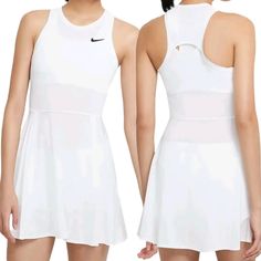 a woman wearing a white tennis dress