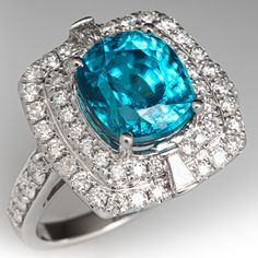 a blue ring with diamonds surrounding it