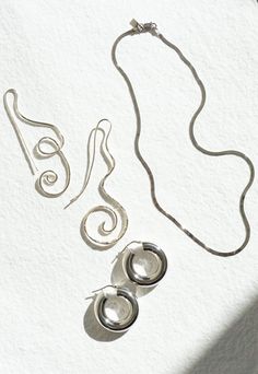 Essentialist Earring from Shannon Bond. Sterling silver hoop with hinge closure. Lightweight for everyday wear. Sold as pair. Need a second opinion? If you have special requests or just need advice, please reach out to hello@shop-vestige.com. Sterling silver. Made in Italy Silver Spiral Fine Jewelry, Minimalist Sterling Silver Clasp Earrings, Modern Spiral Sterling Silver Jewelry, Modern Sterling Silver Spiral Jewelry, Minimalist Spiral Sterling Silver Hoop Earrings, Minimalist Spiral Hoop Earrings In Sterling Silver, Minimalist Spiral Hand Forged Jewelry, Silver Spiral Hoop Earrings For Everyday, Contemporary Hoop Jewelry For Gifts