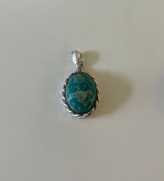 Gorgeous Boho Sterling Silver Turquoise Pendant. Its handmade and one of a kind with unique imperfections. one ever made.  Made of 925 Sterling Silver and Turquoise. (Genuine) Turquoise, the captivating sea-green stone of the ancients, represents wisdom, tranquility, protection, good fortune, and hope. Ancient peoples believed in its profound power to protect, as well as its tranquil energy and its association with enduring love. Likewise, contemporary crystal experts celebrate it for its repres Spiritual Turquoise Oval Pendant Necklace, Blue Chrysocolla Necklace With Large Stone, Handmade Turquoise Chrysocolla Necklace, Artisan Turquoise Oval Pendant Necklace, Bohemian Turquoise Necklace With Large Blue Stone, Blue Turquoise Chrysocolla Necklace With Large Pendant, Blue Turquoise Necklace With Large Chrysocolla Pendant, Turquoise Necklace With Large Chrysocolla Pendant, Spiritual Oval Turquoise Necklace