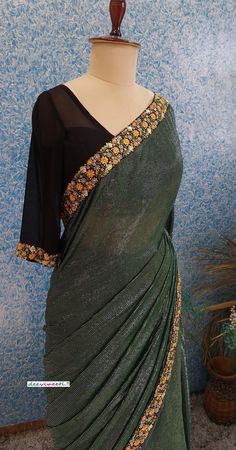 Color : Bottle Green with Shimmer Stripes Fabric - Polyester with multicolor embroidered border Blouse : Black Georgette Blouse (Made to Measure) Underskirt Included The blouse and petticoat will be stitched as per the measurements provided IF YOU WISH TO PURCHASE THIS WE CAN SEND A VIDEO ON YOUR WHATSAPP NUMBER FOR BETTER UNDERSTANDING OF THE SAREE PLEASE NOTE: BUYERS ARE RESPONSIBLE FOR ANY CUSTOMS AND IMPORT TAXES THAT MAY APPLY. Fabric Care : Dry Clean Only Disclaimer: The actual color of th Stripes Fabric, Georgette Blouse, Embroidered Border, Bottle Green, Striped Fabrics, Blouse Black, Indian Designer, Indian Design, Petticoat