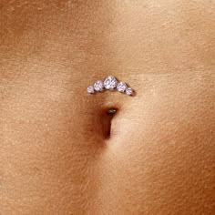 Introducing our stunning Belly Button Ring, a true beauty in navel piercing jewelry. Crafted with precision from ASTM F136 G23 Implant Grade Titanium, this exquisite piece is perfect for both women and men (unisex). This Threadless Floating Convex Base Belly Button Ring features 5 Round Bezel Set Cubic Zirconia, adding a touch of brilliance to your look. With a 14 Gauges (1.6mm) thickness and a comfortable 5/16" (8mm) length, it promises an enjoyable wear. Choose from a range of captivating colo Hip Dermal Piercing, Belly Button Piercing Cute, Cute Belly Rings, Mid Finger Rings, Navel Piercing Jewelry, Titanium Belly Ring, Bellybutton Piercings, Belly Button Piercing Jewelry, Belly Piercing Ring