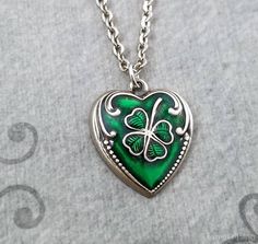 "This listing is for a four leaf clover heart (hollow back) charm necklace. You'll be able to choose your chain length and style at checkout by using the \"Chain Length/Style\" drop-down menu. Keyrings, bangle bracelets, ball chains, and black/brown leather and suede cord are also available. **Please see the second photo for scale! If you're on the mobile site, just swipe to the side. :) The initial charm measures 3/8\". - - - - - - - Sign up for our newsletter to receive coupons and updates on Irish Necklace, Bunny Necklace, Clover Jewelry, Lucky Jewelry, St Patrick's Day Gifts, Irish Jewelry, Green Heart, Clover Necklace, Necklace Green