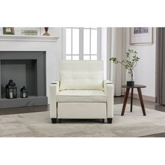 a white chair sitting in front of a fireplace